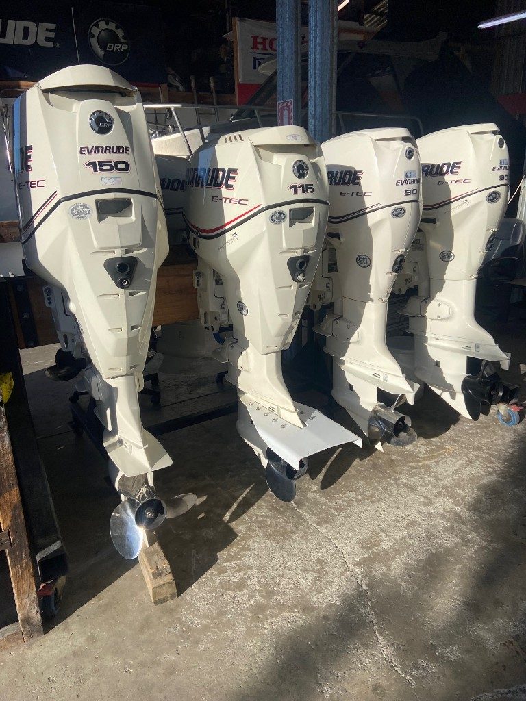 Evinrude E-TEC 150, 115 and 90hp outboards on a stand