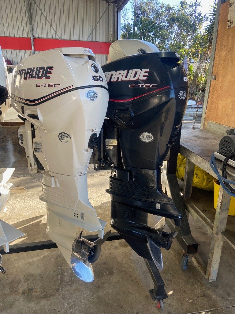 Pair of Evinrude E-TEC 60hp outboards, white and black